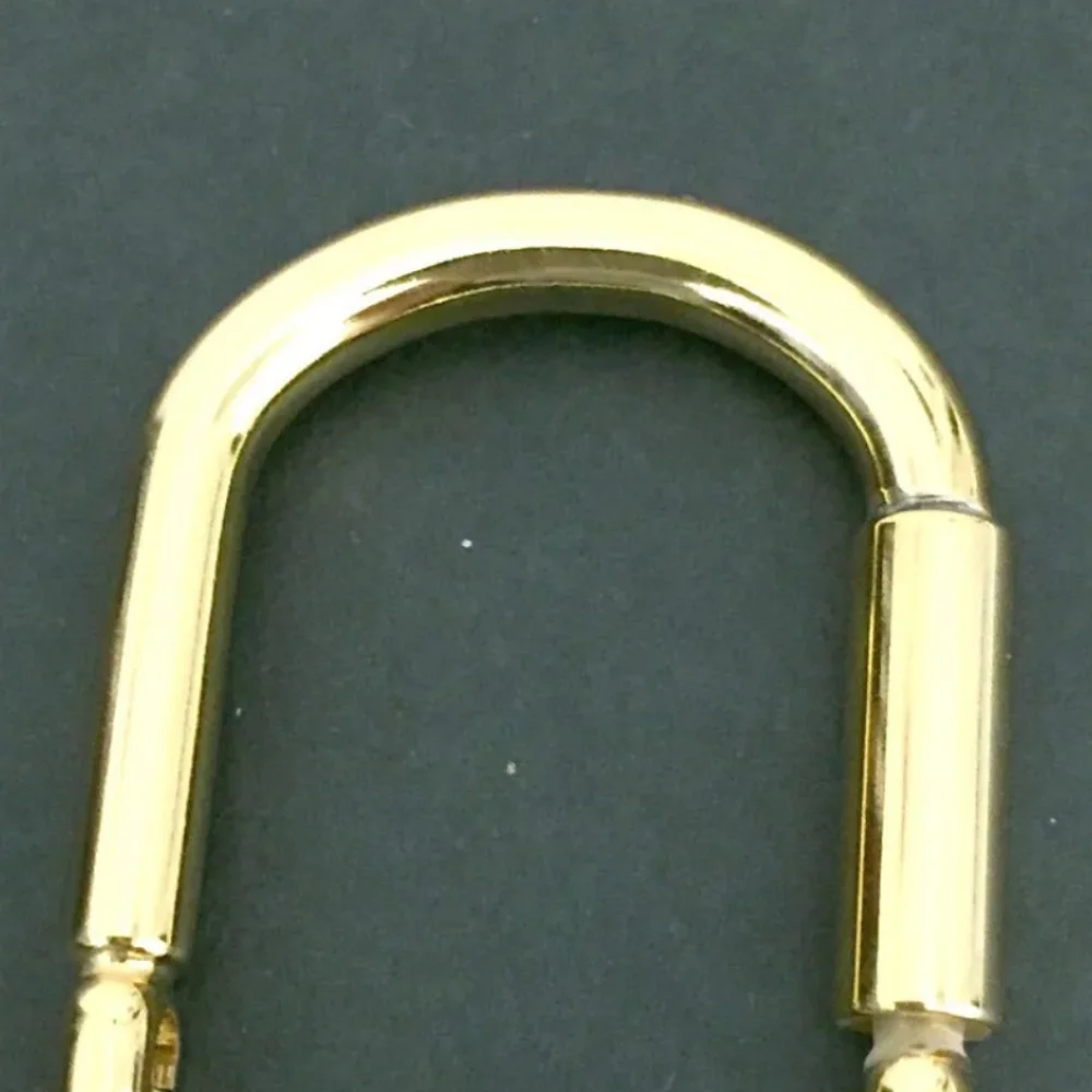 GUCCI INTERLOCKING G SILVER GOLD TONE KEY RING CHARM/UT1930 (UNISEX).